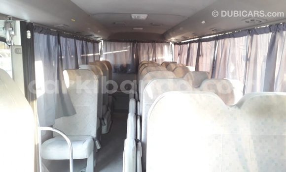 Acheter Import Voiture Toyota Coaster Blanc à Import - Dubai, Ouganda Acheter Import Voiture Toyota Coaster Blanc à Import - Dubai, Ouganda