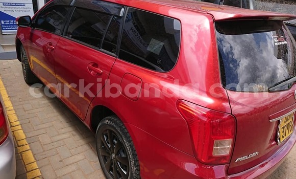 Gura Yakoze Toyota Fielder Red Imodoka i Kampala mu Uganda Gura Yakoze Toyota Fielder Red Imodoka i Kampala mu Uganda