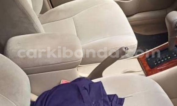 Gura Yakoze Toyota Corolla Brown Imodoka i Kampala mu Uganda Gura Yakoze Toyota Corolla Brown Imodoka i Kampala mu Uganda