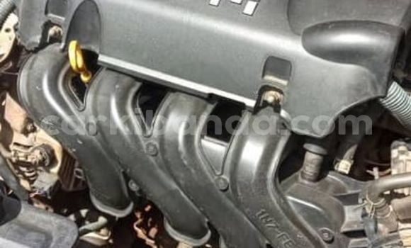 Gura Yakoze Toyota Corolla Brown Imodoka i Kampala mu Uganda Gura Yakoze Toyota Corolla Brown Imodoka i Kampala mu Uganda