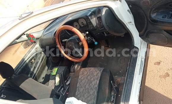 Gura Yakoze Mitsubishi Lancer White Imodoka i Kampala mu Uganda Gura Yakoze Mitsubishi Lancer White Imodoka i Kampala mu Uganda