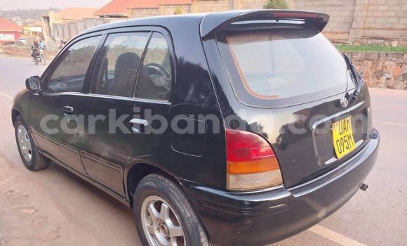 Gura Yakoze Toyota Starlet Black Imodoka i Bugembe mu Eastern Gura Yakoze Toyota Starlet Black Imodoka i Bugembe mu Eastern