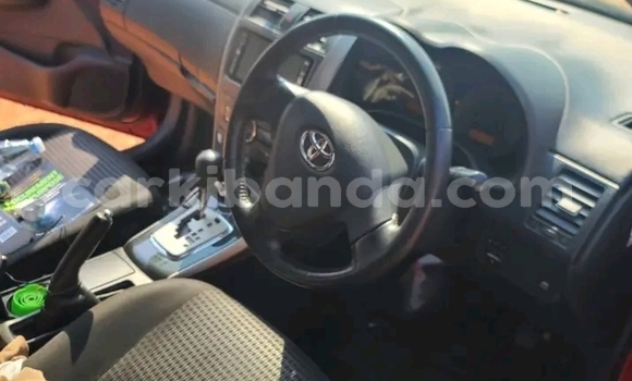 Gura Yakoze Toyota Corolla Red Imodoka i Bugiri mu Eastern Gura Yakoze Toyota Corolla Red Imodoka i Bugiri mu Eastern