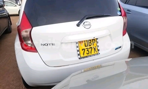 Gura Yakoze Nissan Note White Imodoka i Bugembe mu Eastern Gura Yakoze Nissan Note White Imodoka i Bugembe mu Eastern