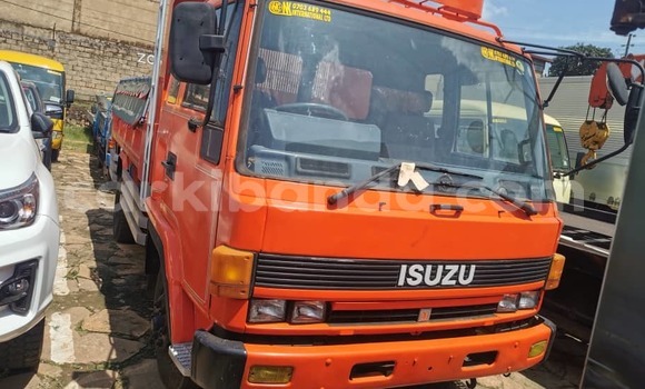Buy Import Isuzu FTR 850 Red Truck in Kampala in Uganda