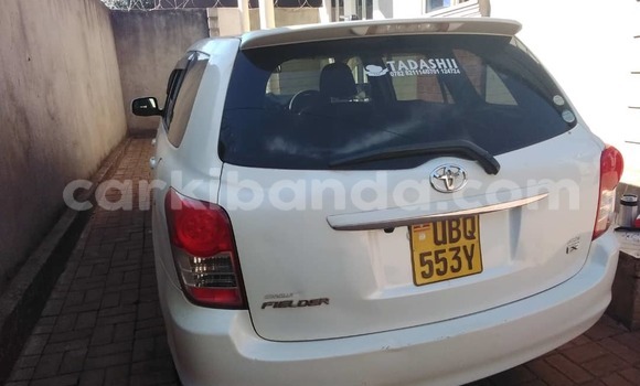 Gura Yakoze Toyota Fielder White Imodoka i Kampala mu Uganda Gura Yakoze Toyota Fielder White Imodoka i Kampala mu Uganda