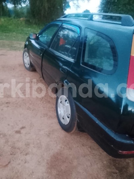 Big with watermark toyota carib rosso uganda jinja 26554