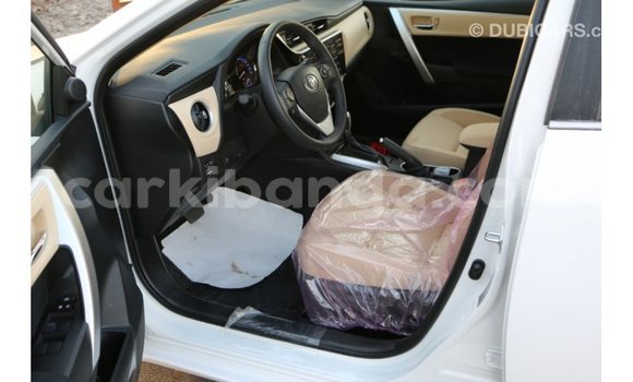 Buy Import Toyota Corolla White Car in Import - Dubai in Uganda Buy Import Toyota Corolla White Car in Import - Dubai in Uganda
