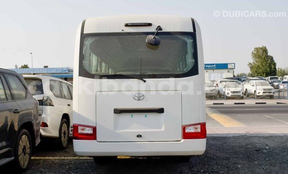 Gura Imported Toyota Coaster White Imodoka i Import - Dubai mu Uganda Gura Imported Toyota Coaster White Imodoka i Import - Dubai mu Uganda