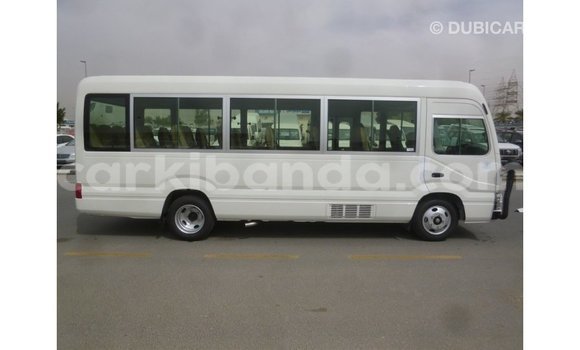 Gura Imported Toyota Coaster White Imodoka i Import - Dubai mu Uganda Gura Imported Toyota Coaster White Imodoka i Import - Dubai mu Uganda