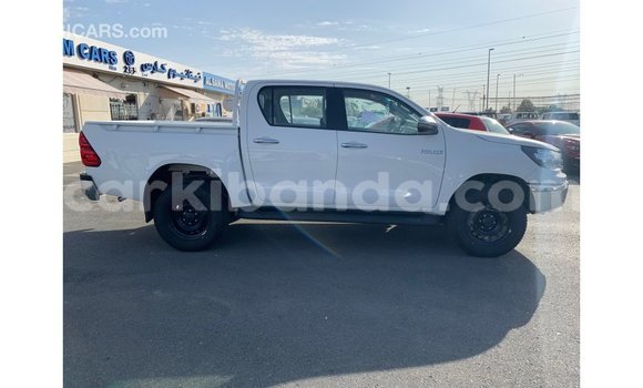 Gura Imported Toyota Hilux White Imodoka i Import - Dubai mu Uganda Gura Imported Toyota Hilux White Imodoka i Import - Dubai mu Uganda