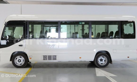 Acheter Import Voiture Toyota Coaster Blanc à Import - Dubai, Ouganda Acheter Import Voiture Toyota Coaster Blanc à Import - Dubai, Ouganda