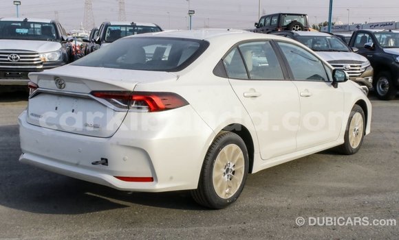 Buy Import Toyota Corolla White Car in Import - Dubai in Uganda Buy Import Toyota Corolla White Car in Import - Dubai in Uganda
