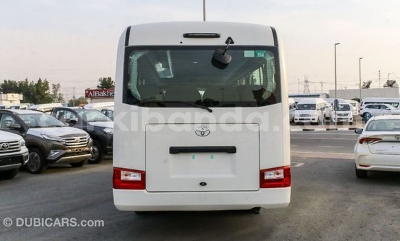 Acheter Import Voiture Toyota Coaster Blanc à Import - Dubai, Ouganda Acheter Import Voiture Toyota Coaster Blanc à Import - Dubai, Ouganda