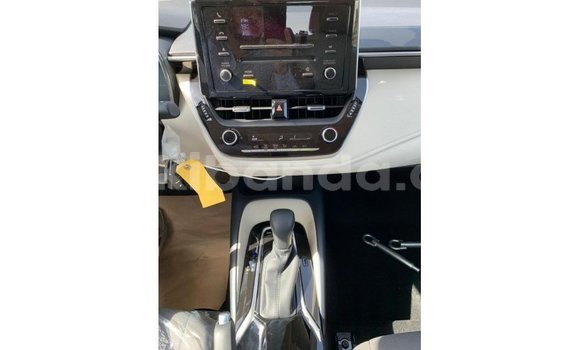 Gura Imported Toyota Corolla White Imodoka i Import - Dubai mu Uganda Gura Imported Toyota Corolla White Imodoka i Import - Dubai mu Uganda