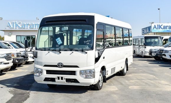 Acheter Import Voiture Toyota Coaster Blanc à Import - Dubai, Ouganda Acheter Import Voiture Toyota Coaster Blanc à Import - Dubai, Ouganda