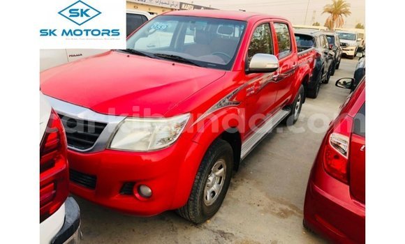Gura Imported Toyota Hilux Red Imodoka i Import - Dubai mu Uganda